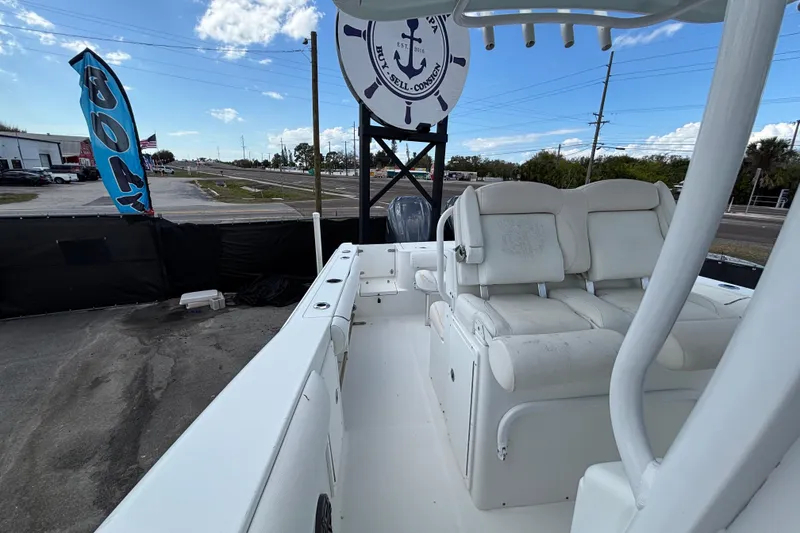 Slide: The Image of 2018 Sea Hunt Gamefish 30 boat with forward seating, displayed outdoors under a clear sky. - 114