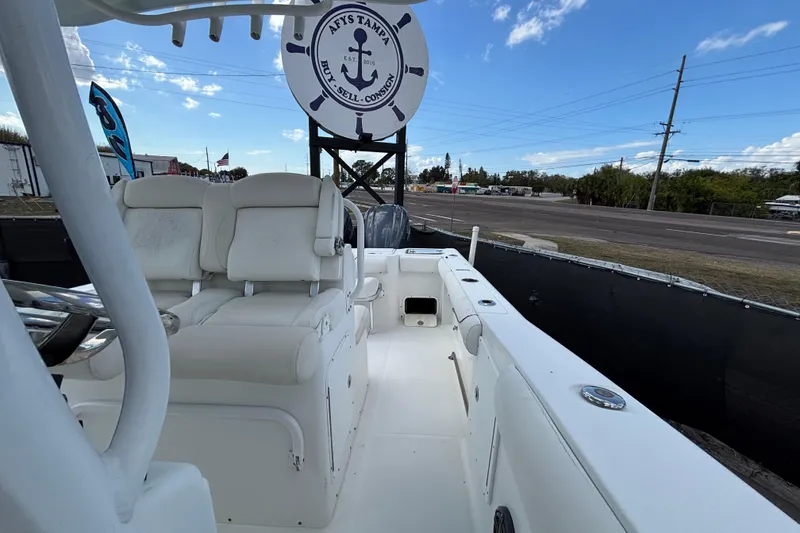 Slide: The Image of 2018 Sea Hunt Gamefish 30 boat with forward seating, displayed outdoors under a clear sky. - 115