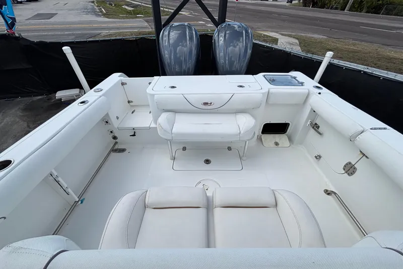 Slide: The Image of 2018 Sea Hunt Gamefish 30 boat interior with forward seating and dual engines. - 118