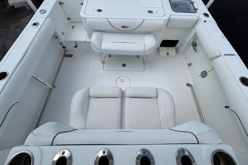 Slide: The Image of 2018 Sea Hunt Gamefish 30 boat interior with forward seating and rod holders. - 119