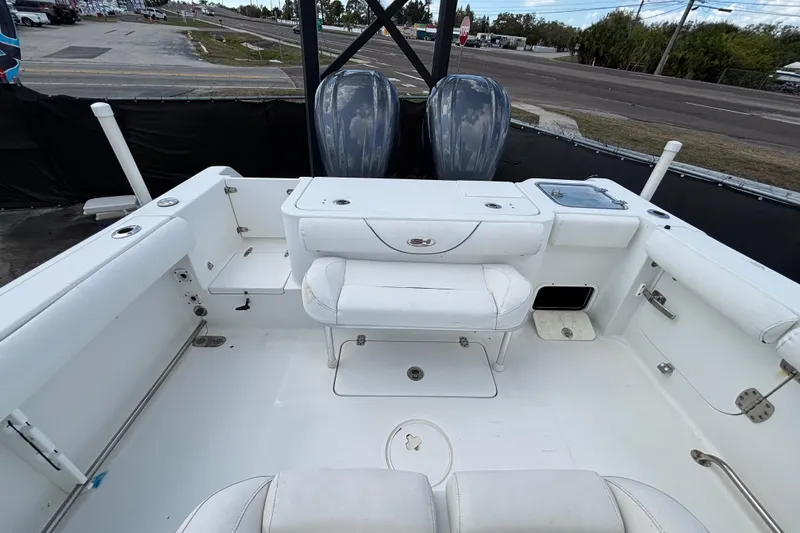 Slide: The Image of 2018 Sea Hunt Gamefish 30 Forward Seating boat interior with dual engines. - 120