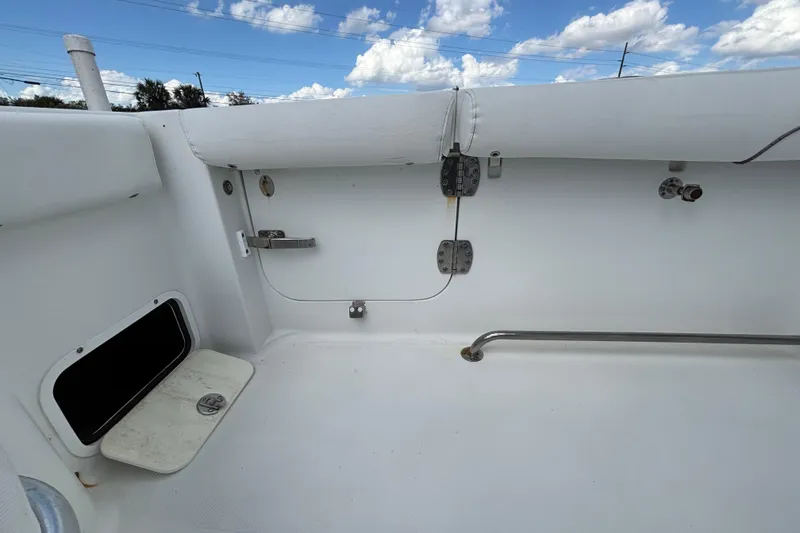 Slide: The Image of 2018 Sea Hunt Gamefish 30 interior, featuring forward seating and storage compartment. - 125