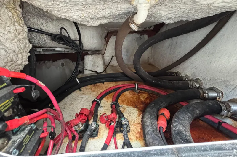 Slide: The Image of Engine compartment of 2018 Sea Hunt Gamefish 30, showing wiring and hoses. - 128