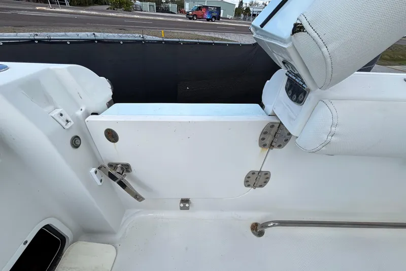 Slide: The Image of 2018 Sea Hunt Gamefish 30 boat interior, featuring forward seating and storage compartments. - 130