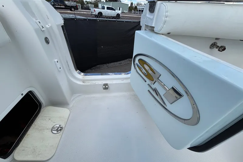 Slide: The Image of 2018 Sea Hunt Gamefish 30 boat interior with logo and seating area. - 133