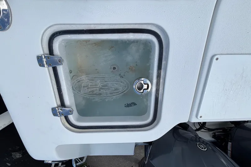 Slide: The Image of 2018 Sea Hunt Gamefish 30 Forward Seating boat compartment with glass door and metal hinges. - 136