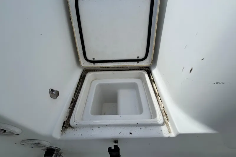 Slide: The Image of Open storage compartment on 2018 Sea Hunt Gamefish 30 Forward Seating boat. - 141