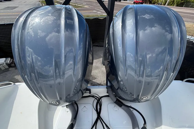 Slide: The Image of Twin outboard engines on a 2018 Sea Hunt Gamefish 30 Forward Seating boat. - 144