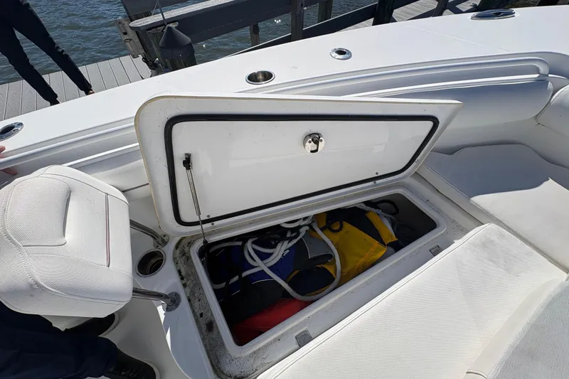 Slide: The Image of 2018 Sea Hunt Gamefish 30 boat with forward seating, docked on a sunny day. - 15
