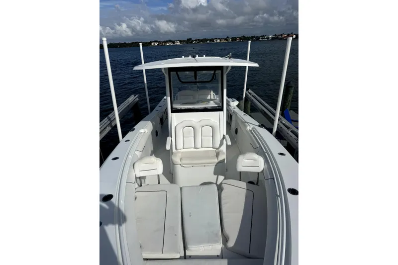 Slide: The Image of 2018 Sea Hunt Gamefish 30 boat docked on calm waters. - 17