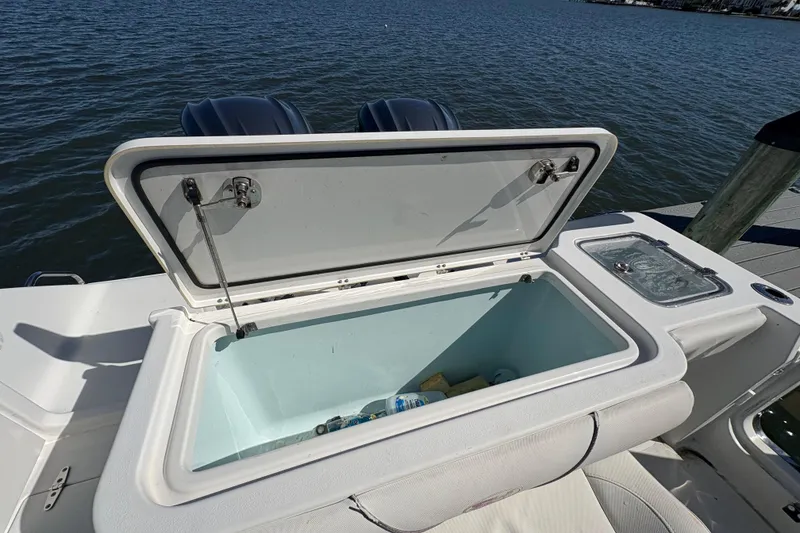 Slide: The Image of 2018 Sea Hunt Gamefish 30 boat interior with forward seating and cup holders. - 3