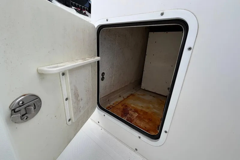 Slide: The Image of Open storage compartment on 2018 Sea Hunt Gamefish 30 Forward Seating boat. - 31