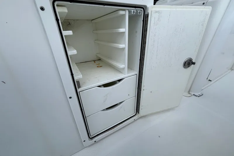 Slide: The Image of Open storage compartment on 2018 Sea Hunt Gamefish 30 Forward Seating boat. - 36