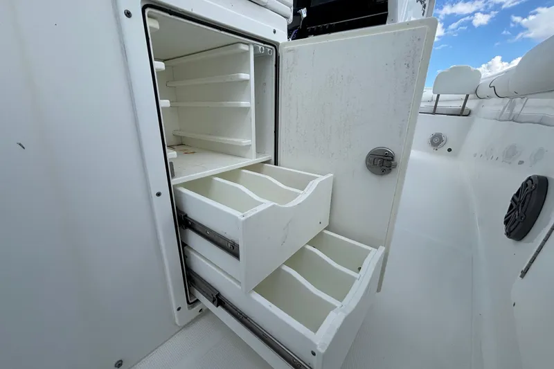 Slide: The Image of 2018 Sea Hunt Gamefish 30 storage compartment with open drawers and shelves. - 38