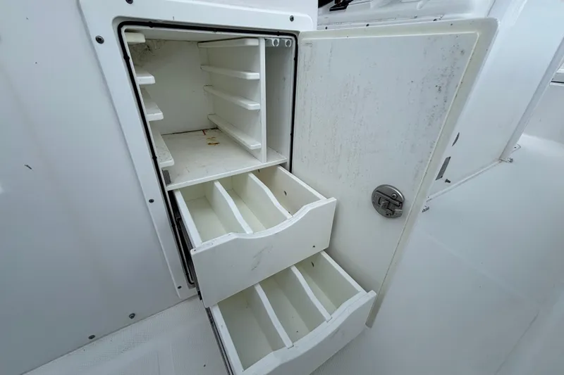 Slide: The Image of 2018 Sea Hunt Gamefish 30 storage compartment with open shelves and drawers. - 39