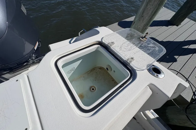 Slide: The Image of 2018 Sea Hunt Gamefish 30 helm with steering wheel and navigation displays. - 5