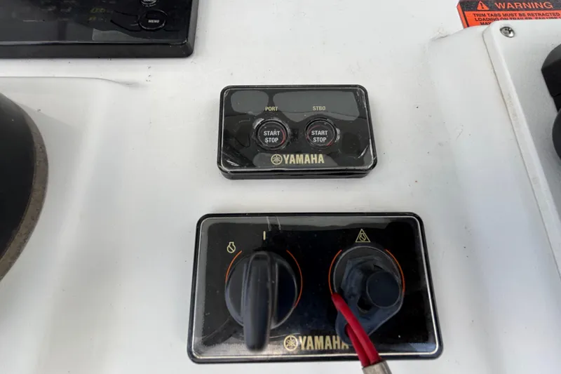 Slide: The Image of Yamaha controls on 2018 Sea Hunt Gamefish 30 boat dashboard. - 56