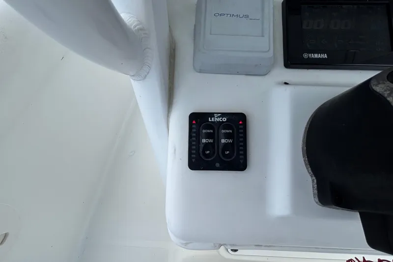 Slide: The Image of Control panel of a 2018 Sea Hunt Gamefish 30 boat with Lenco trim tab switches. - 57