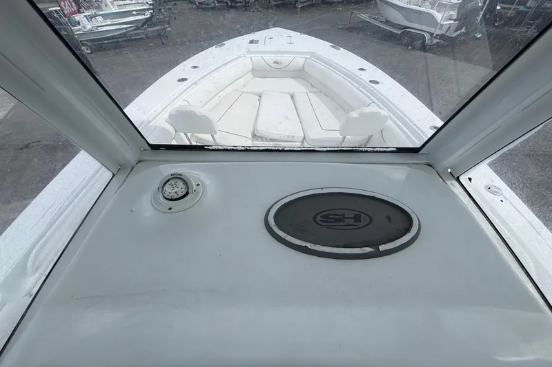 Slide: The Image of 2018 Sea Hunt Gamefish 30 Forward Seating boat interior with spacious seating and navigation equipment. - 67
