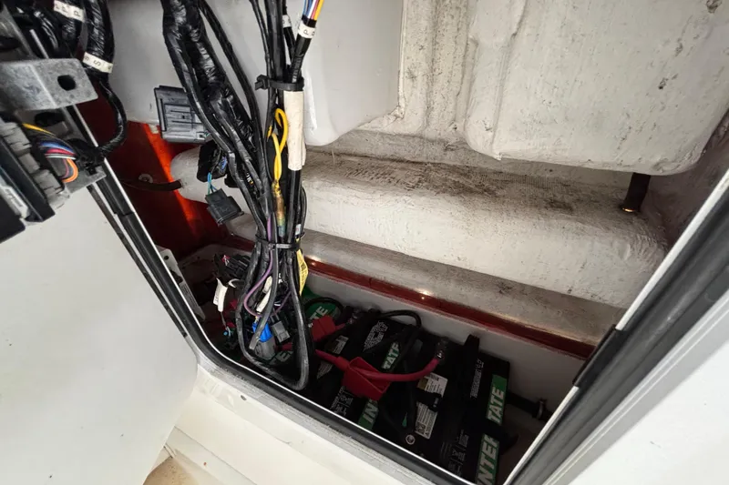 Slide: The Image of Electrical wiring and battery compartment of 2018 Sea Hunt Gamefish 30 Forward Seating boat. - 78