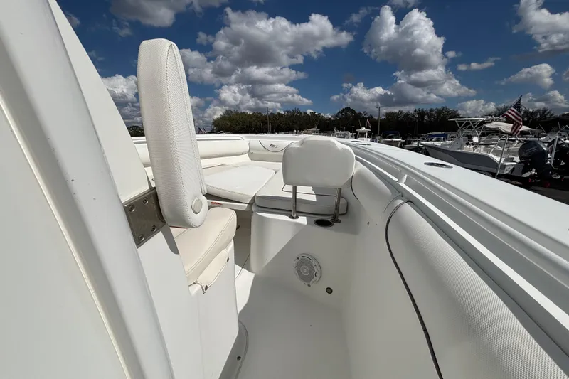 Slide: The Image of 2018 Sea Hunt Gamefish 30 boat with forward seating under a cloudy sky. - 81