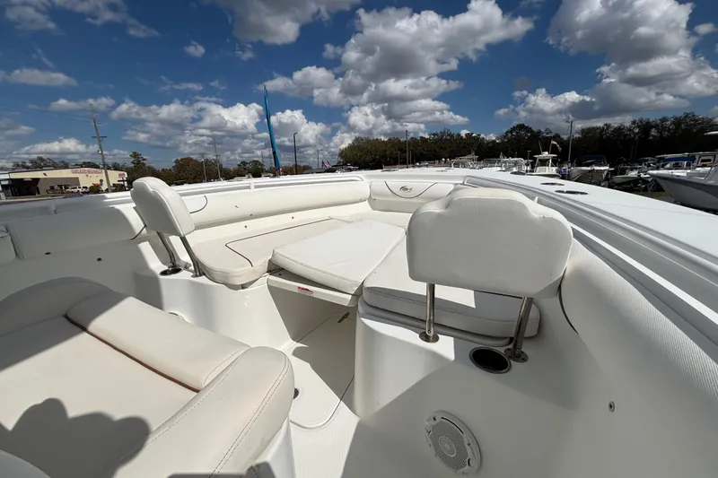 Slide: The Image of 2018 Sea Hunt Gamefish 30 Forward Seating boat under a partly cloudy sky. - 82