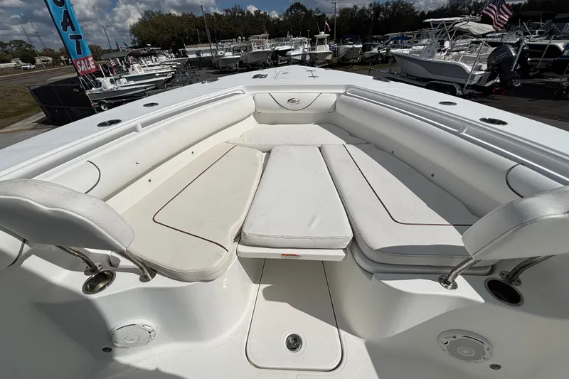Slide: The Image of 2018 Sea Hunt Gamefish 30 Forward Seating boat with spacious white cushioned seating area. - 83