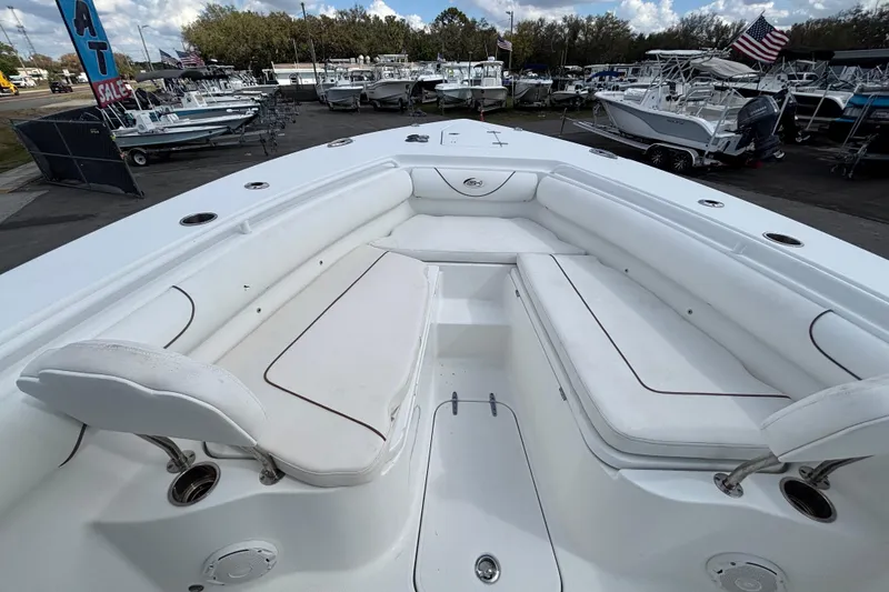 Slide: The Image of 2018 Sea Hunt Gamefish 30 Forward Seating boat with spacious white seating area. - 91