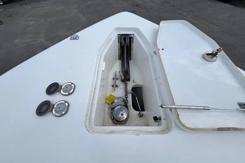 Slide: The Image of 2018 Sea Hunt Gamefish 30 anchor compartment with open hatch and fittings. - 96