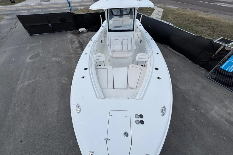 Slide: The Image of 2018 Sea Hunt Gamefish 30 Forward Seating boat, aerial view, docked on pavement. - 98