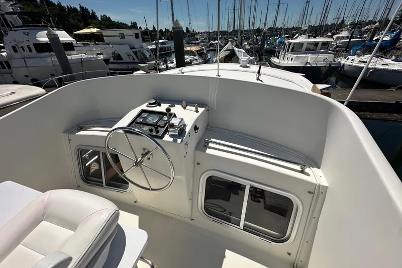 Slide: The Image of Pilothouse view of 2000 Eagle 40 Pilothouse Trawler docked at marina. - 11