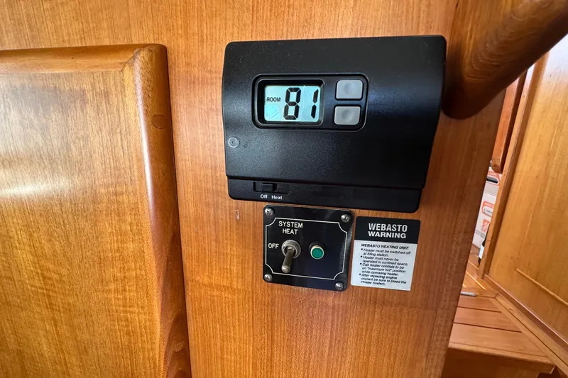 Slide: The Image of Thermostat and control panel on 2000 Eagle 40 Pilothouse Trawler interior. - 27