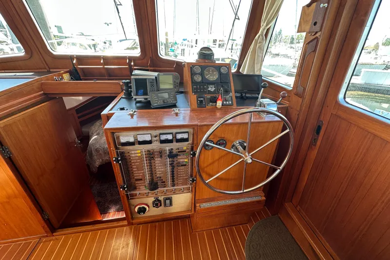 Slide: The Image of Pilothouse of 2000 Eagle 40 Pilothouse Trawler with wooden interior and navigation equipment. - 30