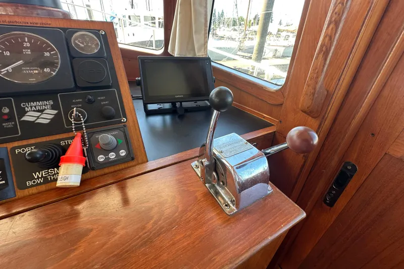 Slide: The Image of Pilothouse controls of 2000 Eagle 40 Pilothouse Trawler with Cummins Marine panel. - 46