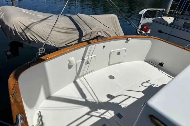 Slide: The Image of Cockpit of 2000 Eagle 40 Pilothouse Trawler with wooden trim and covered equipment. - 6