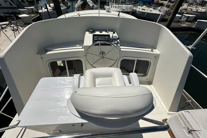 Slide: The Image of Pilothouse of 2000 Eagle 40 Pilothouse Trawler with steering wheel and captain's chair. - 9