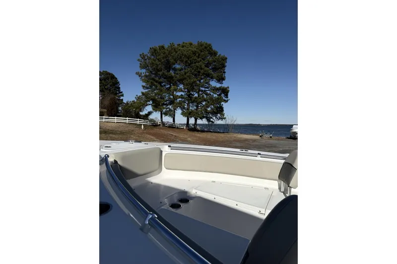 Slide: The Image of 2026 Key West 239 FS boat interior with scenic lakeside view and trees. - 5