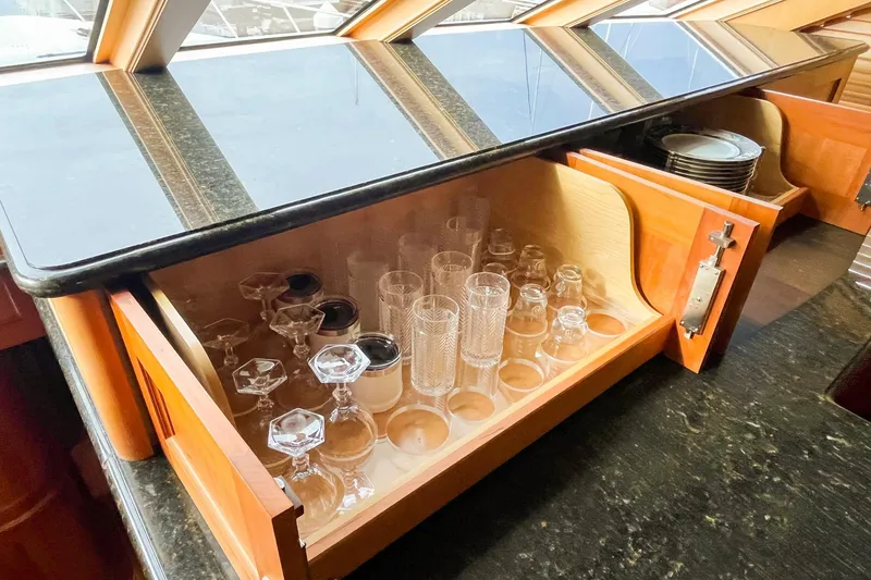 Slide: The Image of Luxurious 2001 Nordlund yacht interior with glassware storage in an enclosed command bridge. - 15