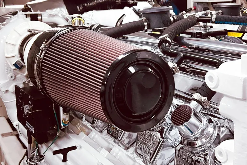 Slide: The Image of Engine compartment of a 2001 Nordlund Enclosed Command Bridge yacht, featuring detailed components. - 32