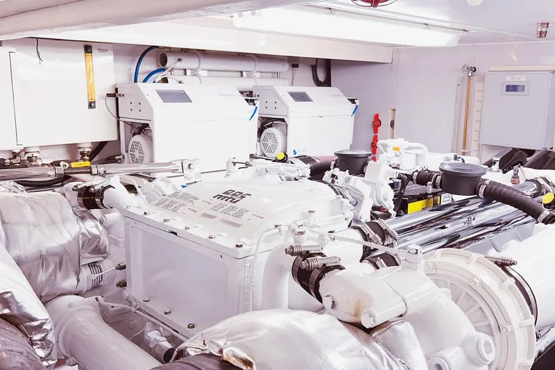 Slide: The Image of Engine room of 2001 Nordlund Enclosed Command Bridge yacht, featuring advanced machinery and equipment. - 37