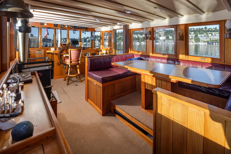 Slide: The Image of Interior of a 1931 Boeing Custom boat with wooden furnishings and panoramic windows. - 31