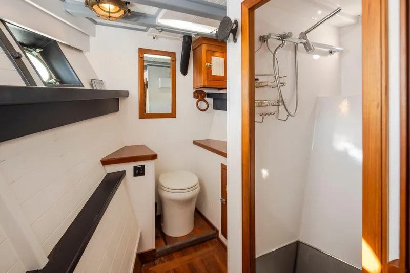 Slide: The Image of Bathroom interior of a 1931 Boeing Custom model, featuring a shower and toilet. - 46
