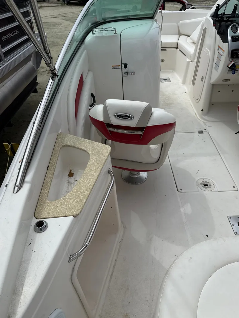 Slide: The Image of Interior of a 2007 Chaparral 236SSX boat with seating and helm console. - 10