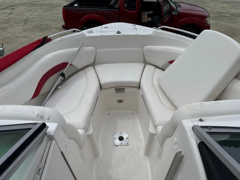 Slide: The Image of Interior of a 2007 Chaparral 236SSX boat with white seating. - 4