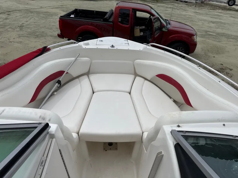 Slide: The Image of Interior view of a 2007 Chaparral 236SSX boat with red accents. - 5