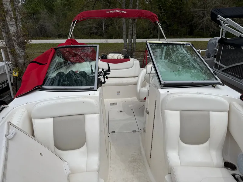 Slide: The Image of Interior view of a 2007 Chaparral 236SSX boat with white seating. - 6