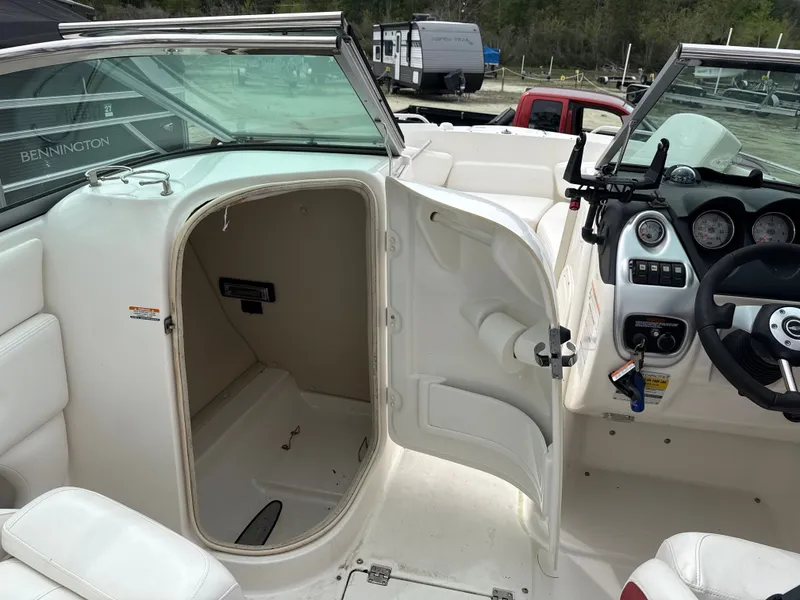 Slide: The Image of Interior of a 2007 Chaparral 236SSX boat with open storage compartment. - 7