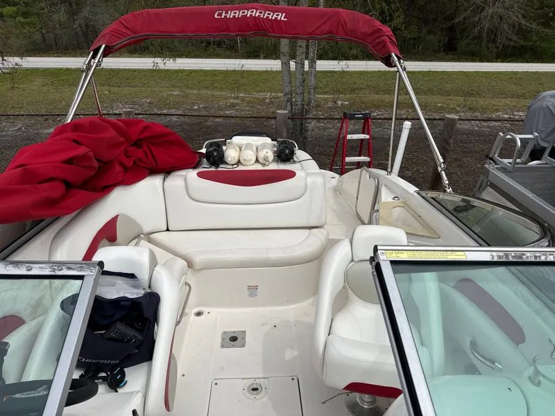 Slide: The Image of Interior of a 2007 Chaparral 236SSX boat with red canopy. - 8