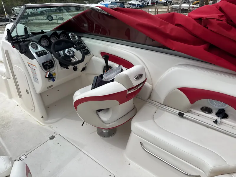 Slide: The Image of Interior of a 2007 Chaparral 236SSX boat with red cover. - 9