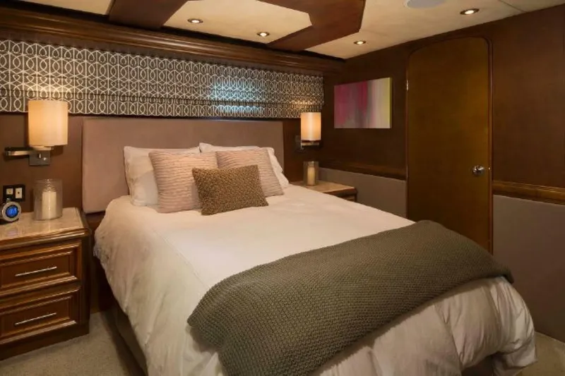 Slide: The Image of Luxurious bedroom interior in 2006 Broward Raised Pilothouse yacht, featuring elegant decor and cozy bedding. - 10